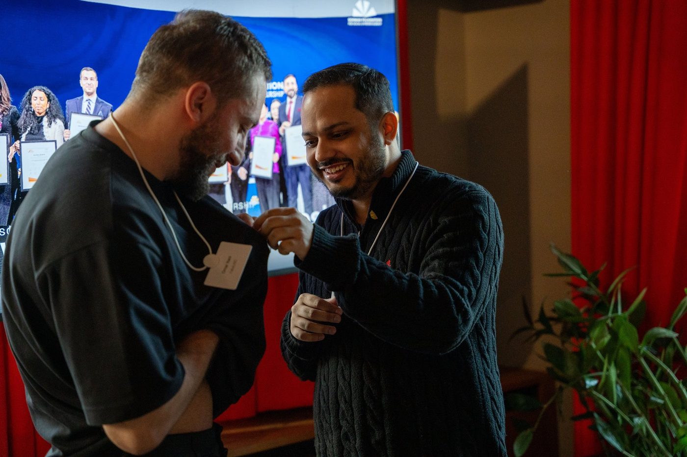Minhaj Chowdhury in conversation with a fellow Schwab Foundation awardee at the social innovators' gathering before the Annual Meeting, Davos, January 2026.